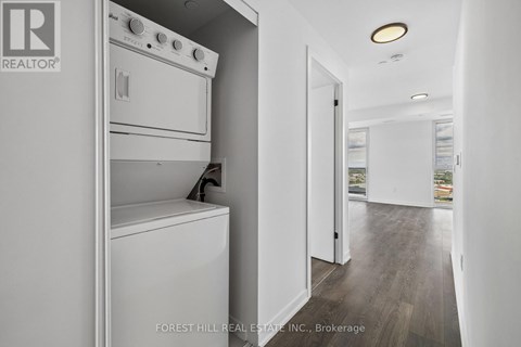 A white oven and dishwasher in a modern kitchen.