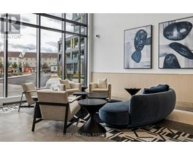 A living room with a view of the street outside the window.