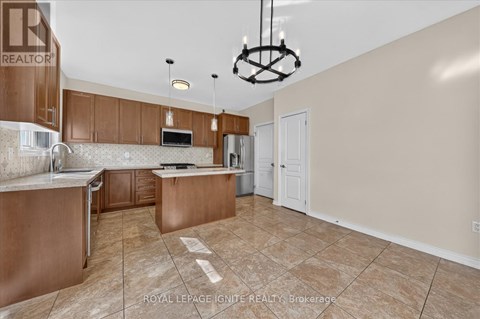 A kitchen with brown cabinets and a white countertop.
