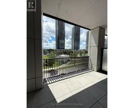 A balcony with a view of a cityscape.