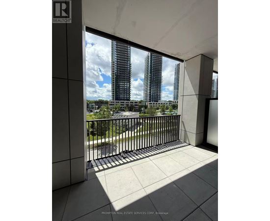A balcony with a view of a cityscape.