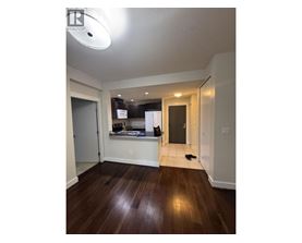 A room with a wooden floor and a white ceiling.