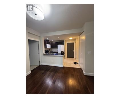 A room with a wooden floor and a white ceiling.