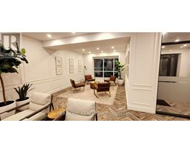 A living room with a couch, chairs, and a coffee table.