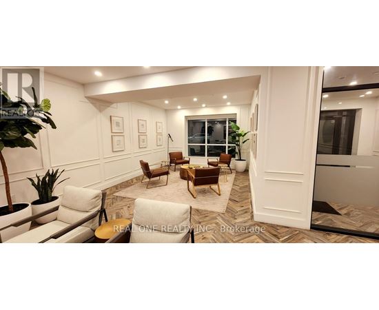 A living room with a couch, chairs, and a coffee table.