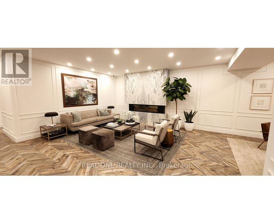 A living room with a large painting on the wall and a fireplace.