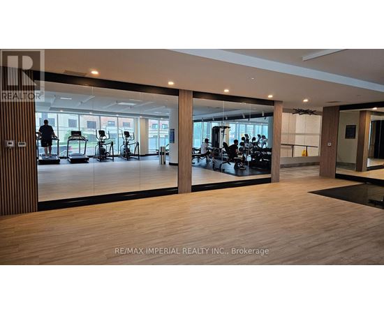 A gym with a variety of equipment is shown in the image.