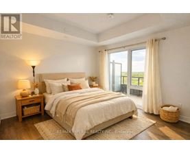 A bedroom with a large bed, a nightstand with a lamp, and a view of the outdoors through a sliding glass door.
