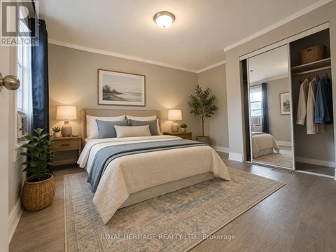 A bedroom with a large bed and a painting on the wall.