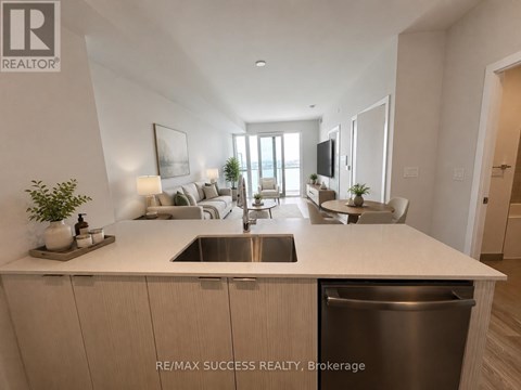 A modern kitchen with a sink and a dishwasher.