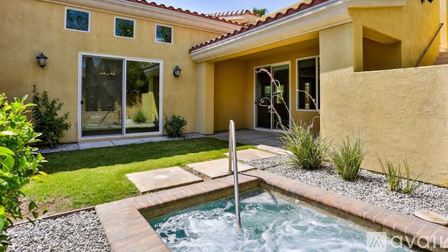 A house with a pool in the backyard.
