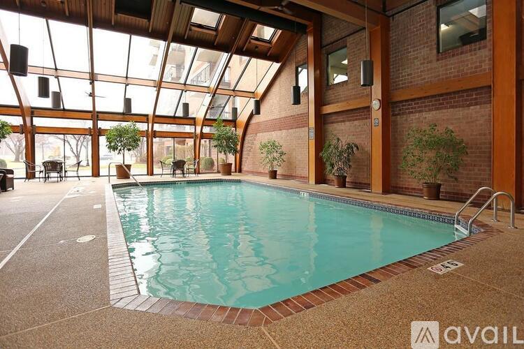 A large indoor swimming pool with a glass ceiling.