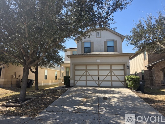 A house with a garage is for sale.
