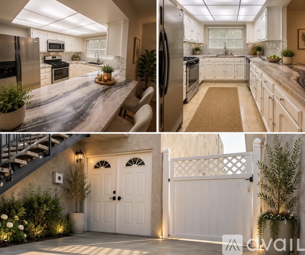 A modern kitchen with a staircase leading to the upper level.