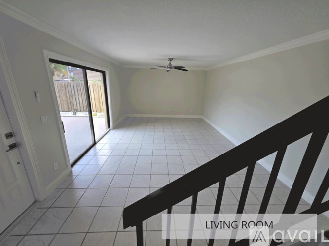 A living room with a staircase leading to the upper floor.