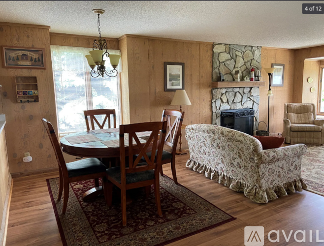 A living room with a fireplace and a couch.