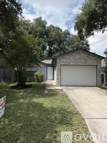 A house with a garage is for sale.
