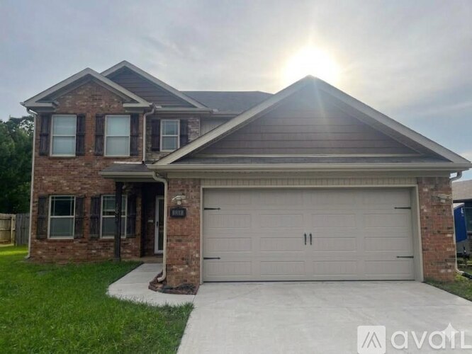 A house with a garage door that has the number 11 on it.