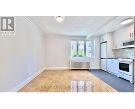 A realtor logo is on the top left corner of the image.