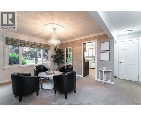 A well-lit dining room with a table set for four.