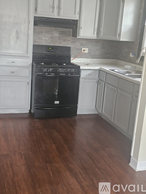 A black oven with the word DELUXE on it.