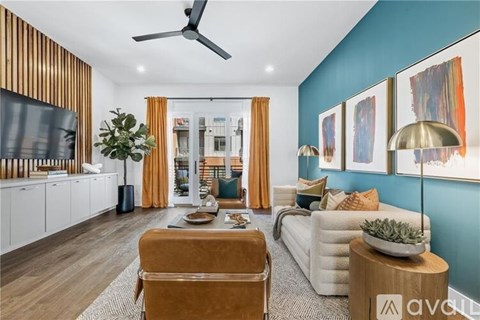A living room with a brown sofa and a television.