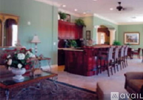 A living room with a red couch and a coffee table.