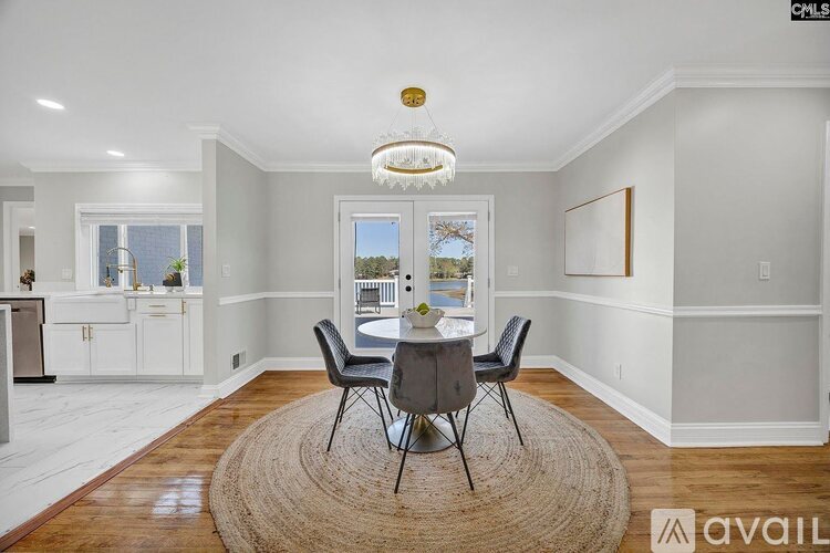A dining room with a table set for four.