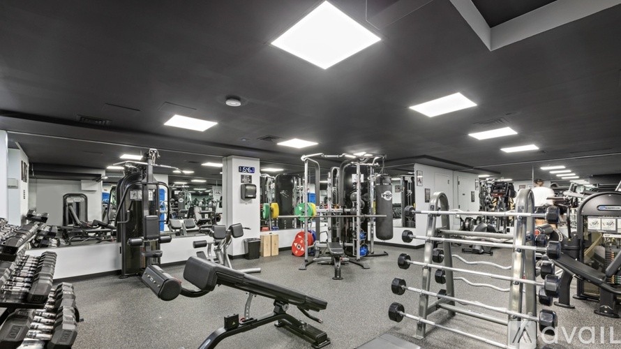 A gym with various exercise equipment and a sign that says "available".