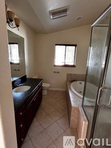 A bathroom with a sink, toilet, and bathtub.