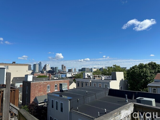 A cityscape with buildings and a clear sky.