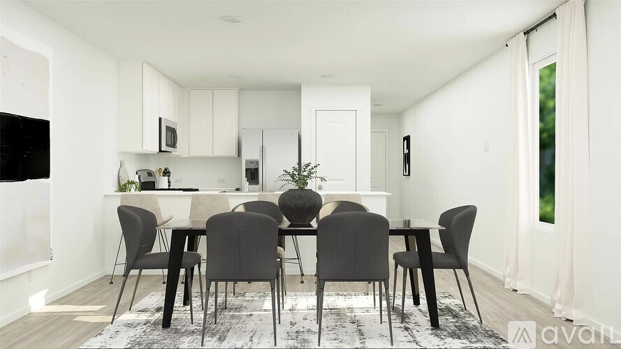 A modern dining room with a table set for four.