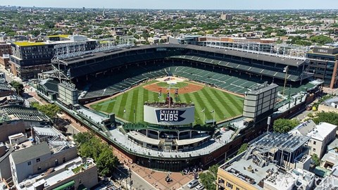 A large baseball stadium with the word Cubs on the field.