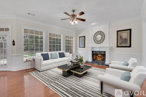 A living room with a fireplace and a couch.