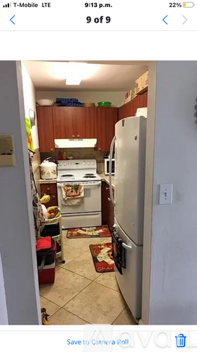 A kitchen with a white refrigerator and a white oven.
