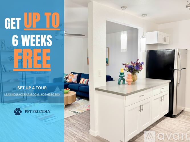A modern kitchen with a black fridge and white cabinets is on offer for a 6 week free lease.