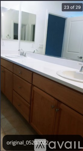 A bathroom with a sink and mirror.