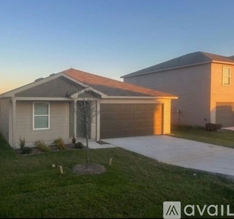 A house with a garage and a driveway.