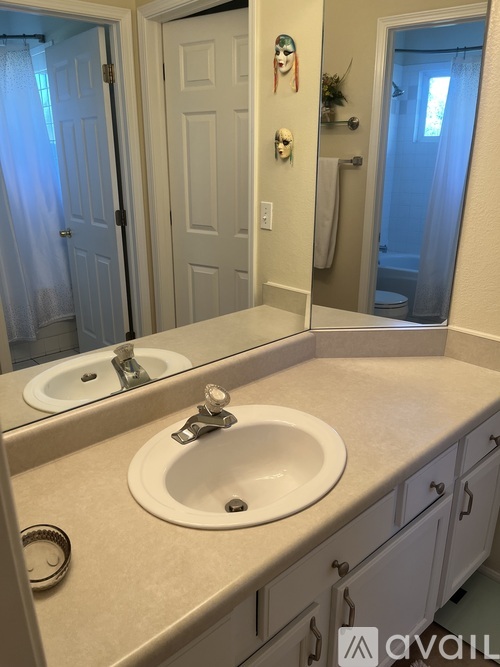 A bathroom with a sink and mirror.