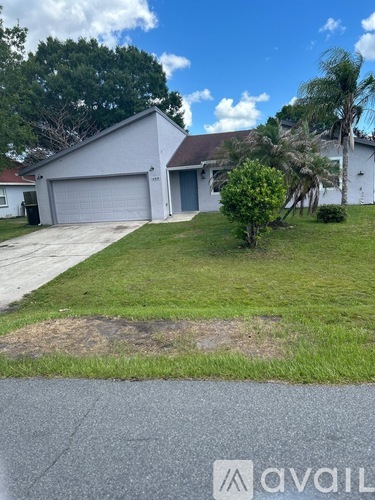 A house with a white garage door is for sale.