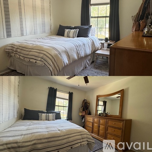 A bedroom with a large bed and a wooden dresser.
