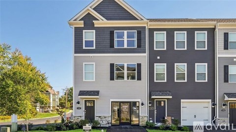A two-story house with a grey and white exterior.