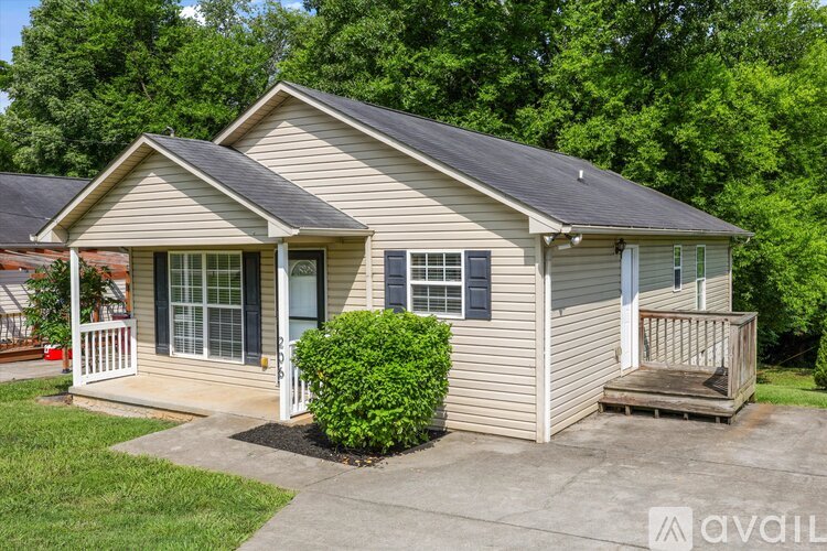 A house with a front porch and a small front yard.