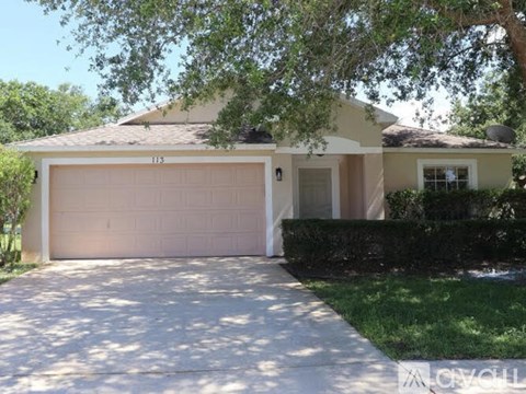A house with a white garage door and a driveway.