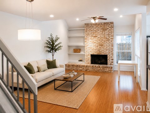 A living room with a fireplace and a couch.