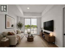 A modern living room with a large window and a flat screen TV.