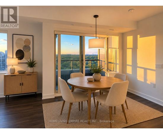 A dining room with a table set for four and a view of the city.