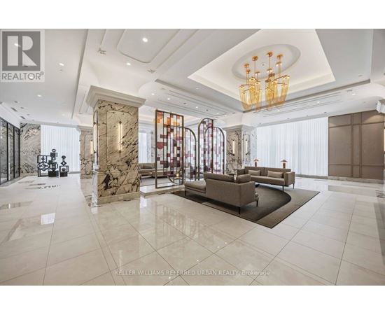 A spacious living room with a marble floor and a chandelier.