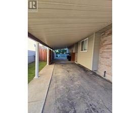 A long covered walkway between two houses.
