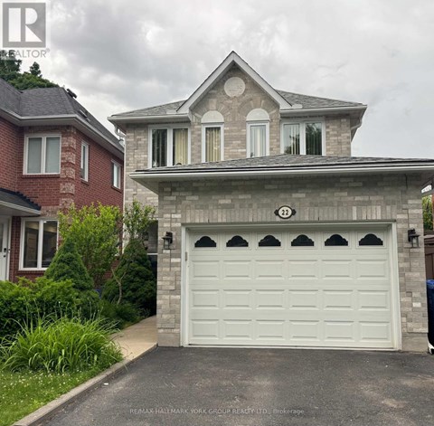 A house with a white garage door in front of it.